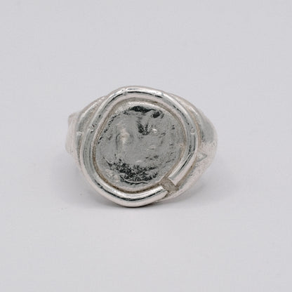 Silver ARTE ring with a textured surface resembling an ancient coin