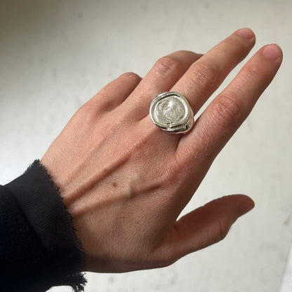 Silver ARTE ring with a textured surface resembling an ancient coin