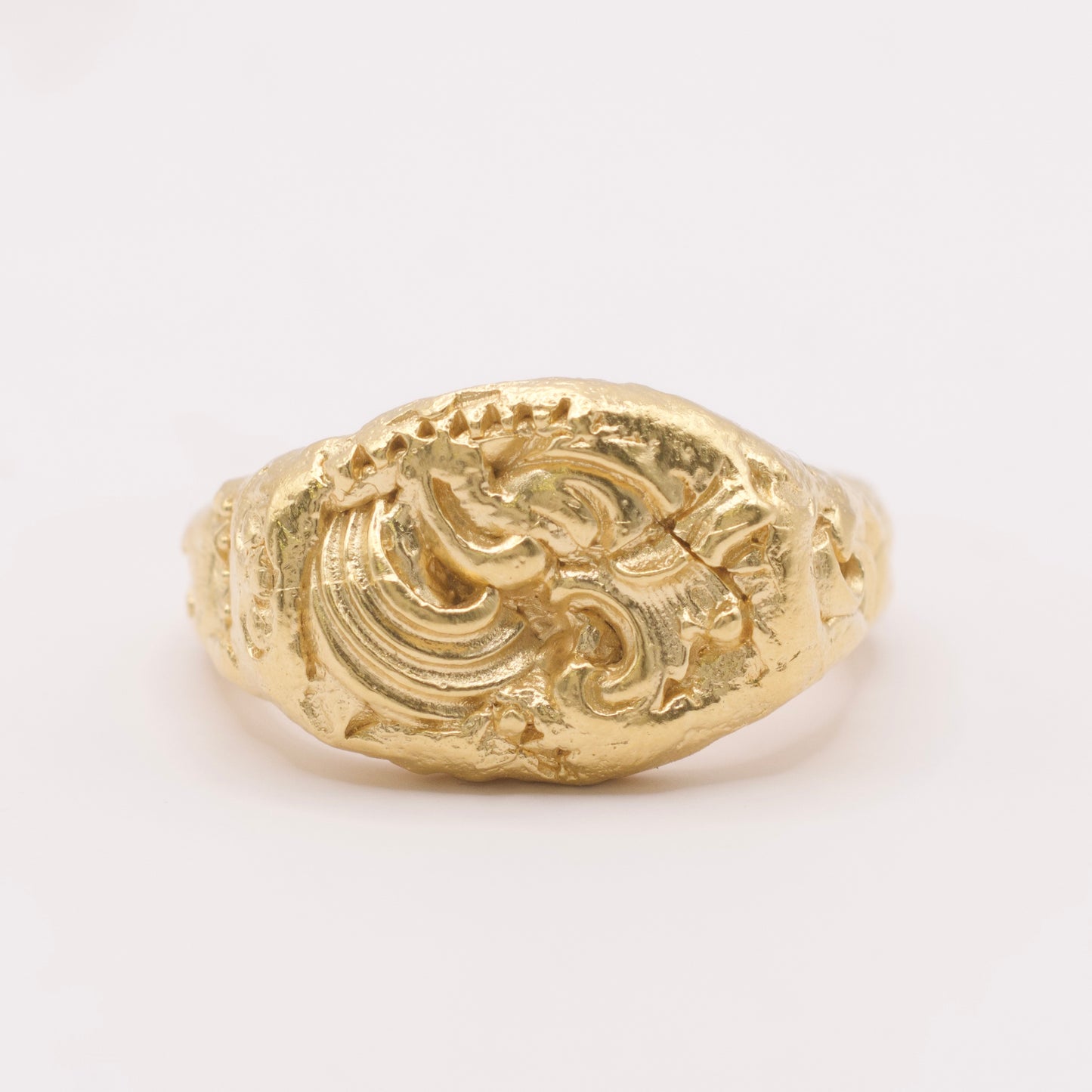 18 karat gold ring with intricate design 