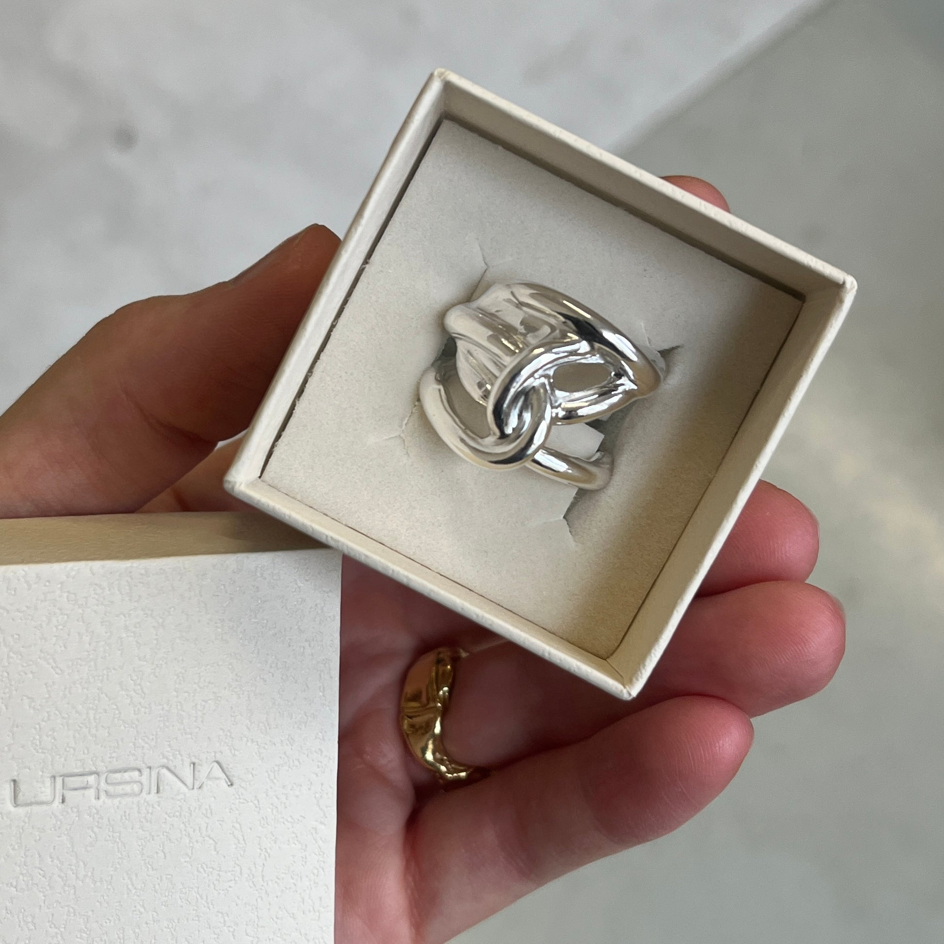 Silver ring with a knot design