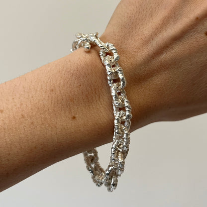 Silver elegant VELA chain bracelet on a wrist 